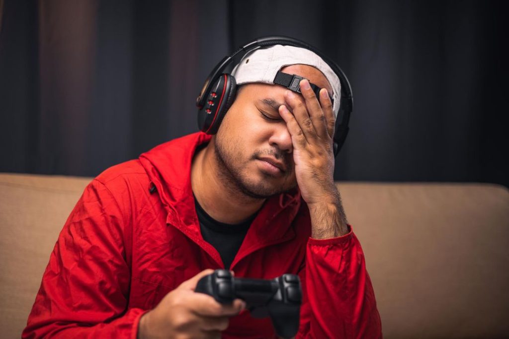 sadness gamer man holding joystick