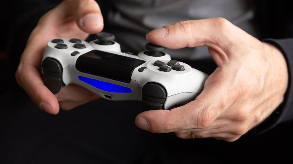 a man holding game controller
