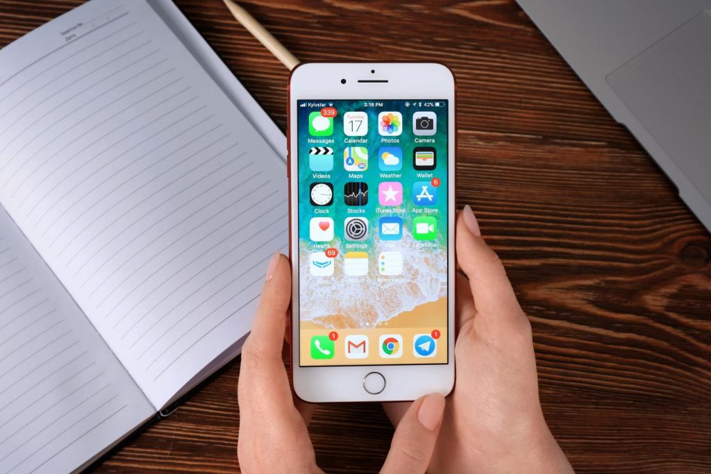holding an iPhone