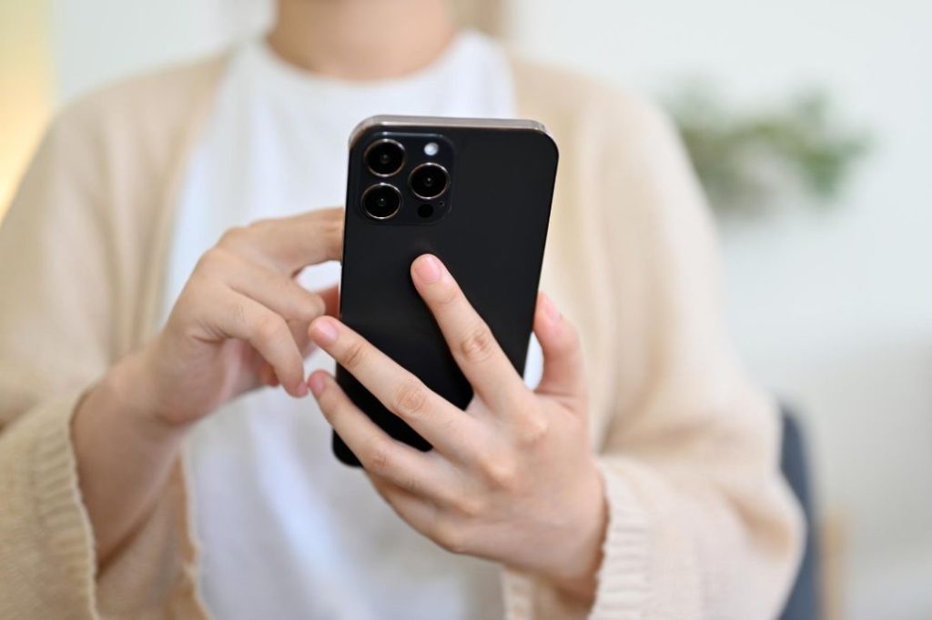 Holding iPhone