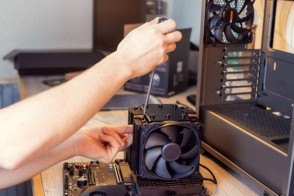 technician installing cpu cooler