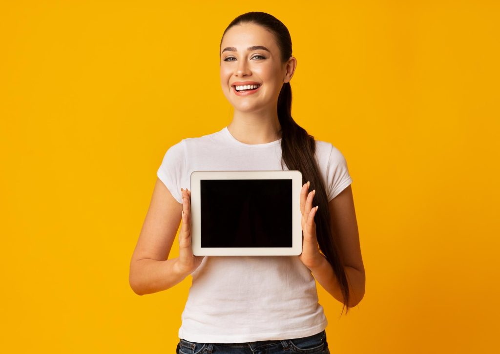 women holding tablet